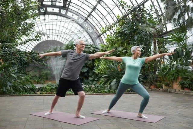An old couple exercising together to improve their health after an expert mental heath care consultation from Pleasant Place Psychiatry